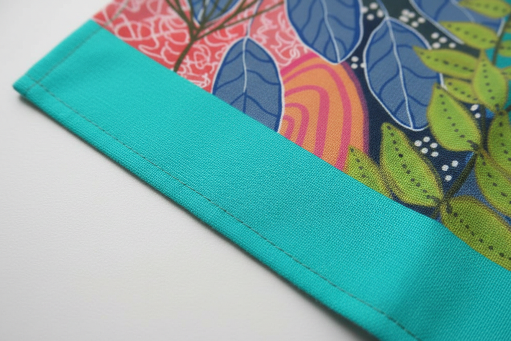 Close-up corner detail of Summer Awakening tea towel