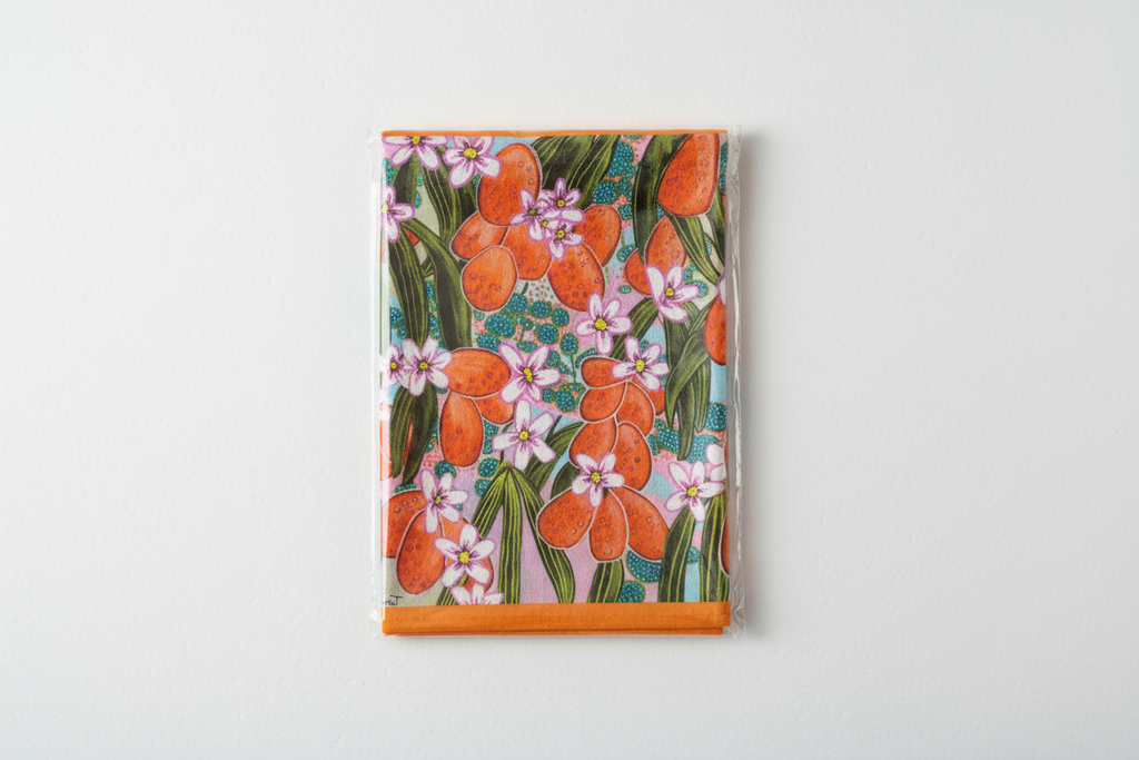 Orange Blossom tea towel in simple folded packaging