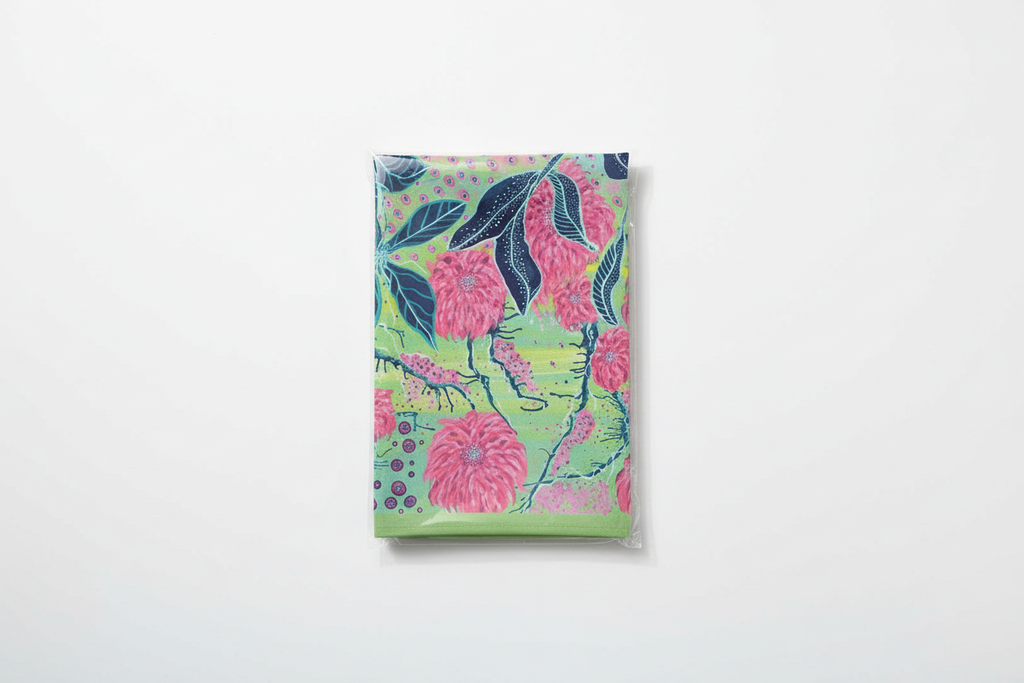 Radiant Dahlia tea towel in simple folded packaging