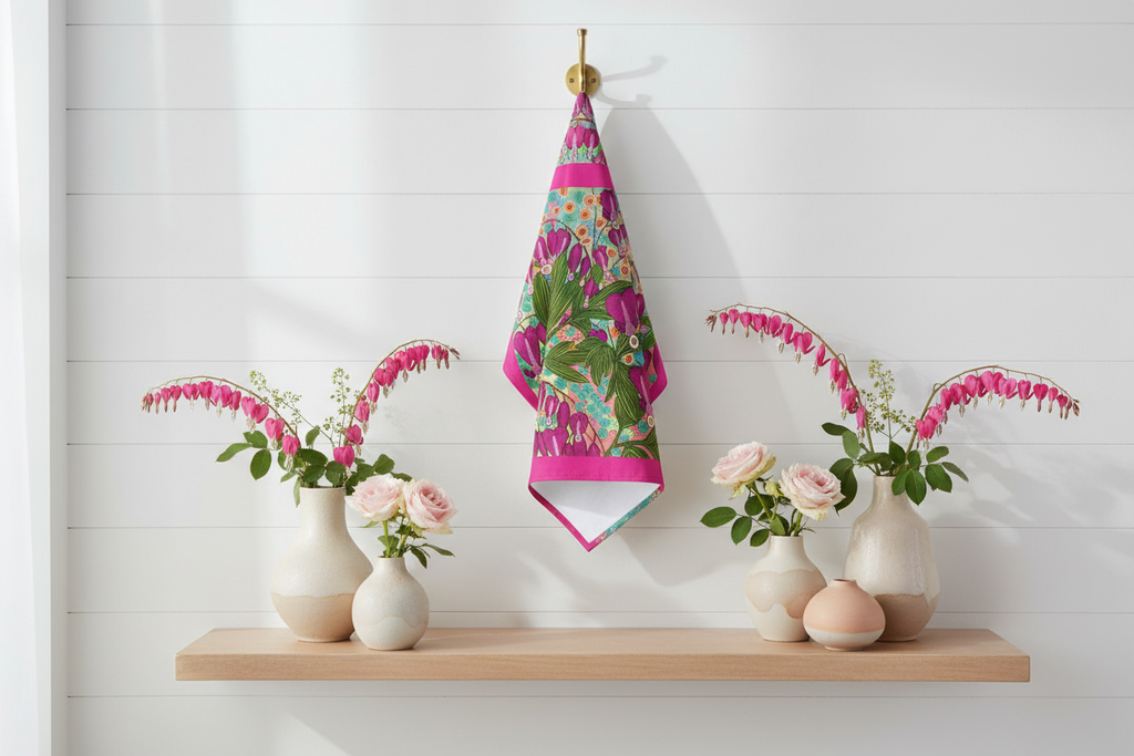 Bleeding Hearts tea towel displayed as kitchen wall art