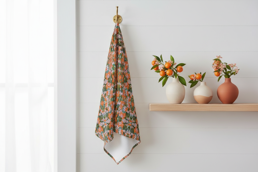 Orange Blossom geometric tea towel displayed as kitchen wall art